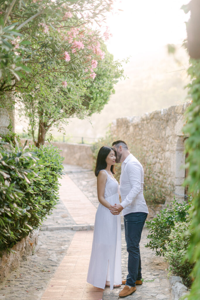 Romantic engagement photo session in Eze, French Riviera, with panoramic sea views and medieval stone alleys at golden hour