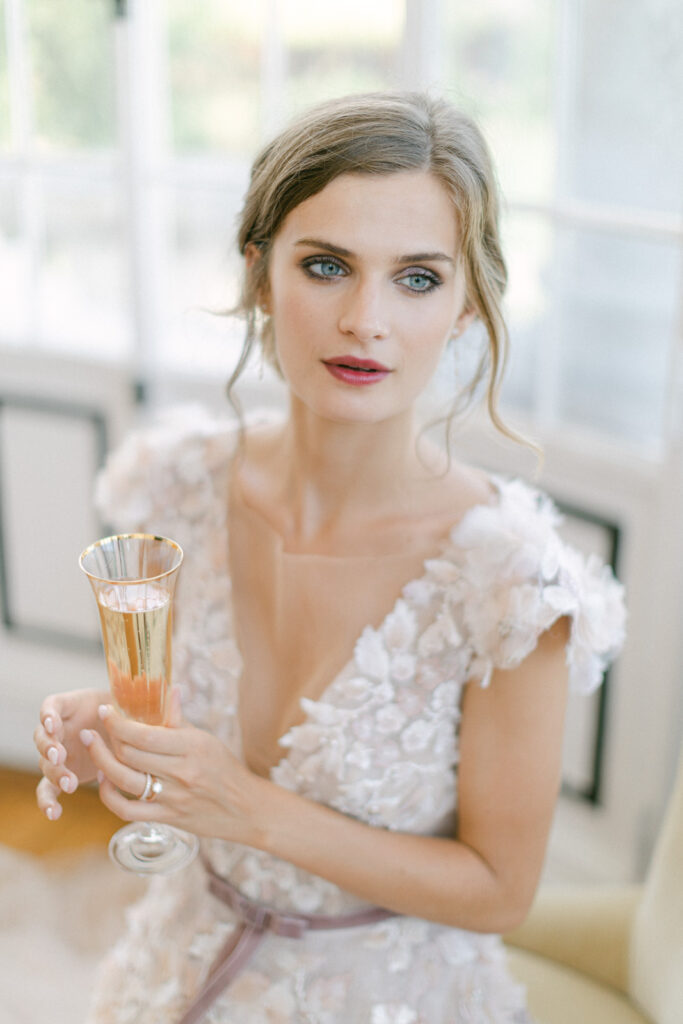 Chateau Mader wedding toast: couple's joyous champagne clink