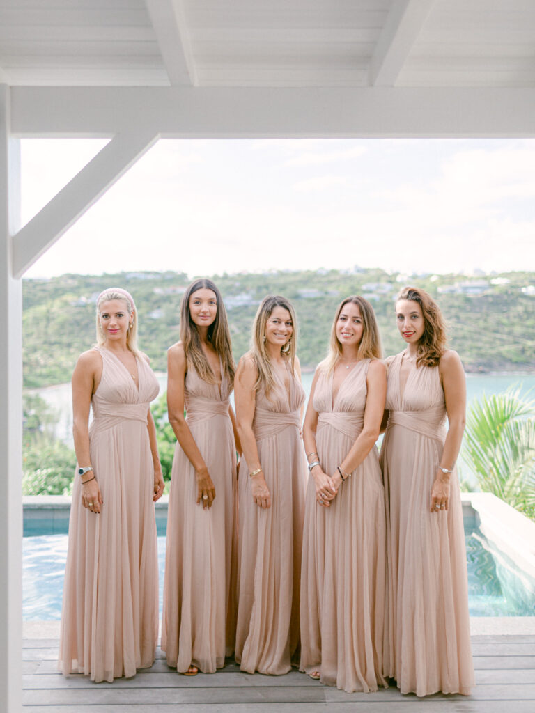 Elegant bridal gown hung, anticipating St Barts beach vows