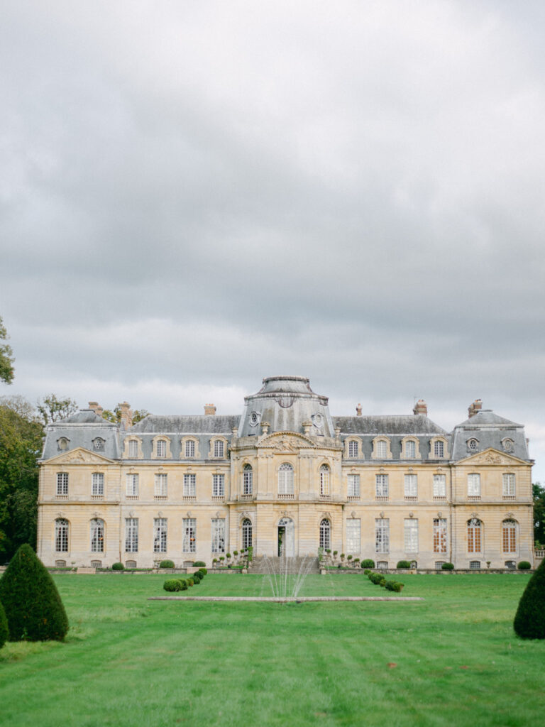 The majestic façade of Château de Champlatreux, with its classic French architecture, offers a breathtaking backdrop for luxury weddings near Paris