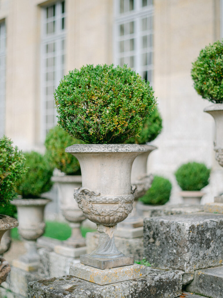 The sprawling gardens of Château de Champlatreux showcase nature's splendor, complementing the luxury wedding ambiance near Paris.