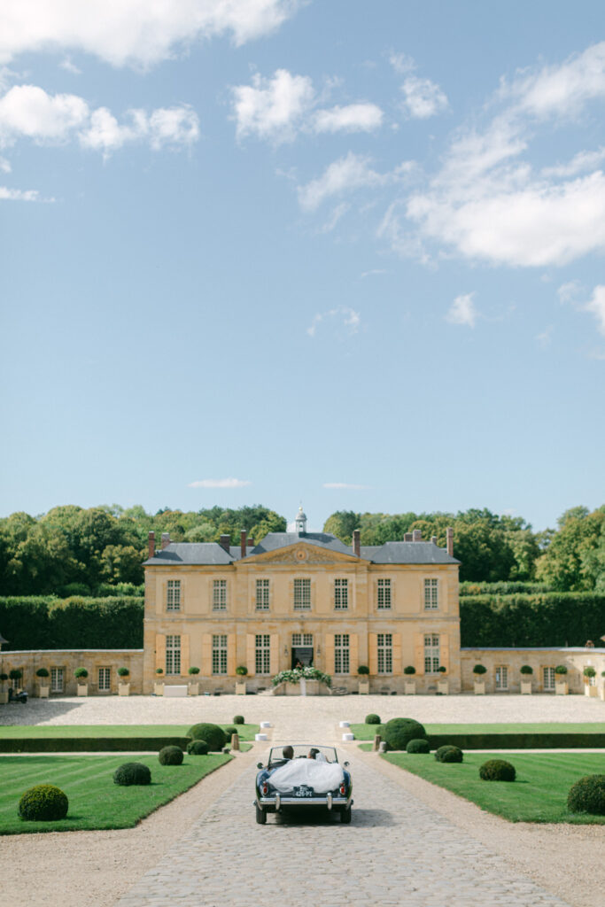 Surrounded by the lush vistas of Chateau de Villette, their first look is a tender preamble to the opulence and charm of their Parisian wedding day