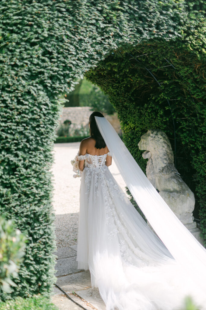 Beneath the age-old trees of Chateau de Villette, their eyes meet for the first time on their wedding day, igniting the magic of their Parisian love story