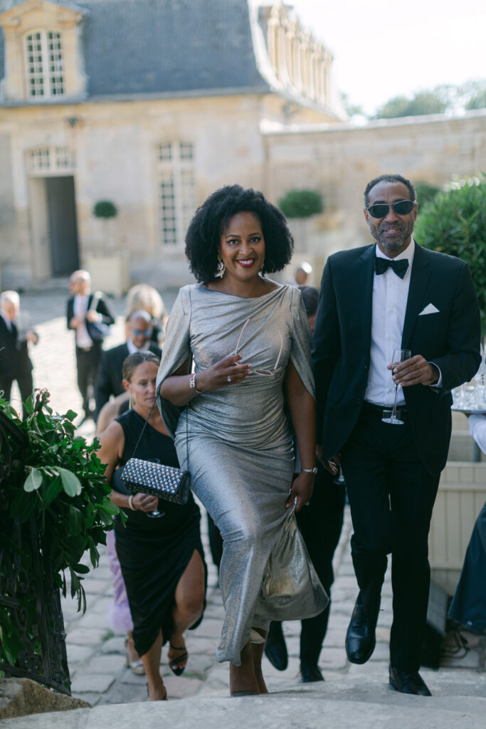Elegance and laughter fill the air during the cocktail hour at Chateau de Villette, where Parisian chic meets timeless charm