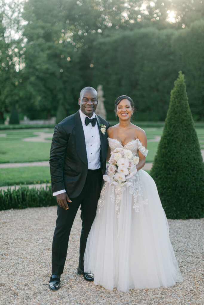 n the golden hour of 'Chateau de Villette: An Elegant Parisian Wedding,' the couple’s photo session captures their love, framed by the chateau's timeless beauty.