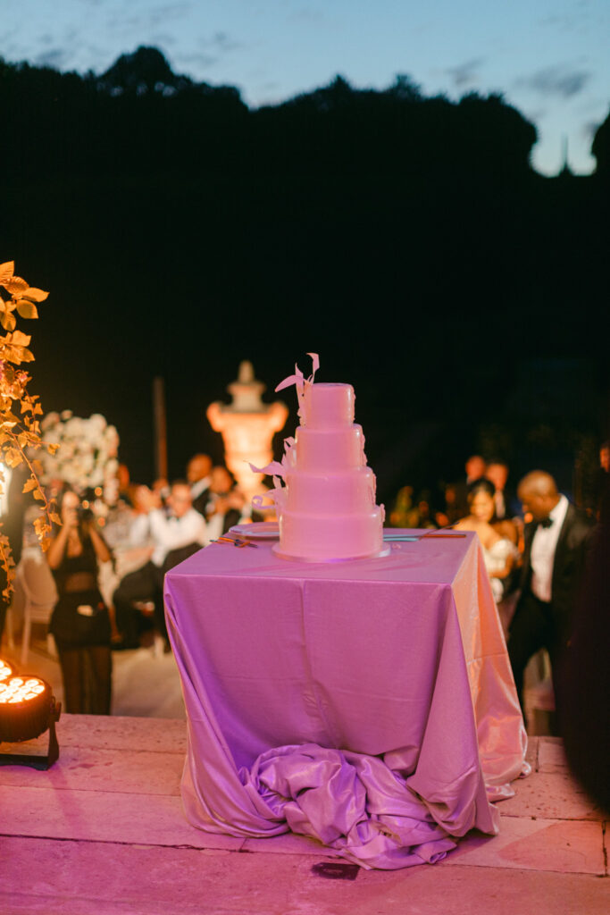 The cake-cutting at 'Chateau de Villette: An Elegant Parisian Wedding' is a moment of sweet elegance, where the couple shares a symbol of their love under the chateau's grandeur