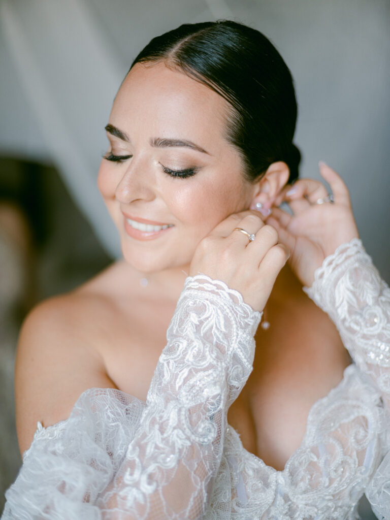 A bride’s Puglian wedding affair begins with delicate touches of makeup in a room filled with anticipation