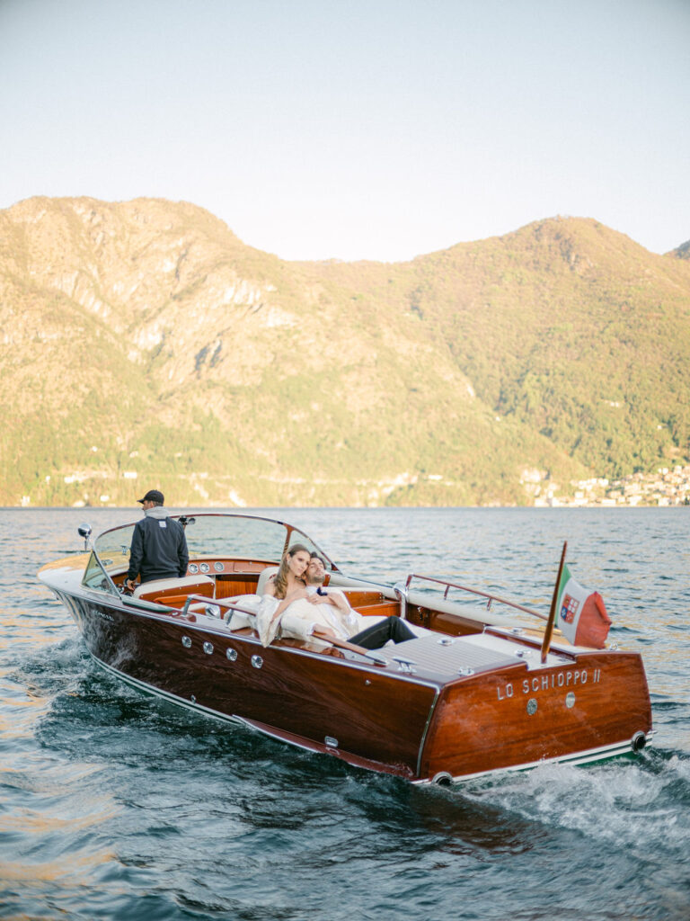 Together, the couple navigates the calm waters of Lake Como, symbolizing their journey ahead, anchored in their Luxury Balbiano Wedding.