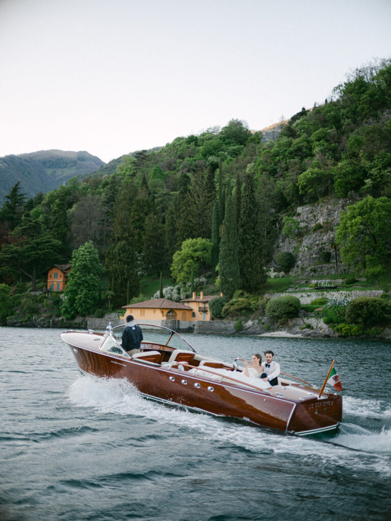 Together, the couple navigates the calm waters of Lake Como, symbolizing their journey ahead, anchored in their Luxury Balbiano Wedding.