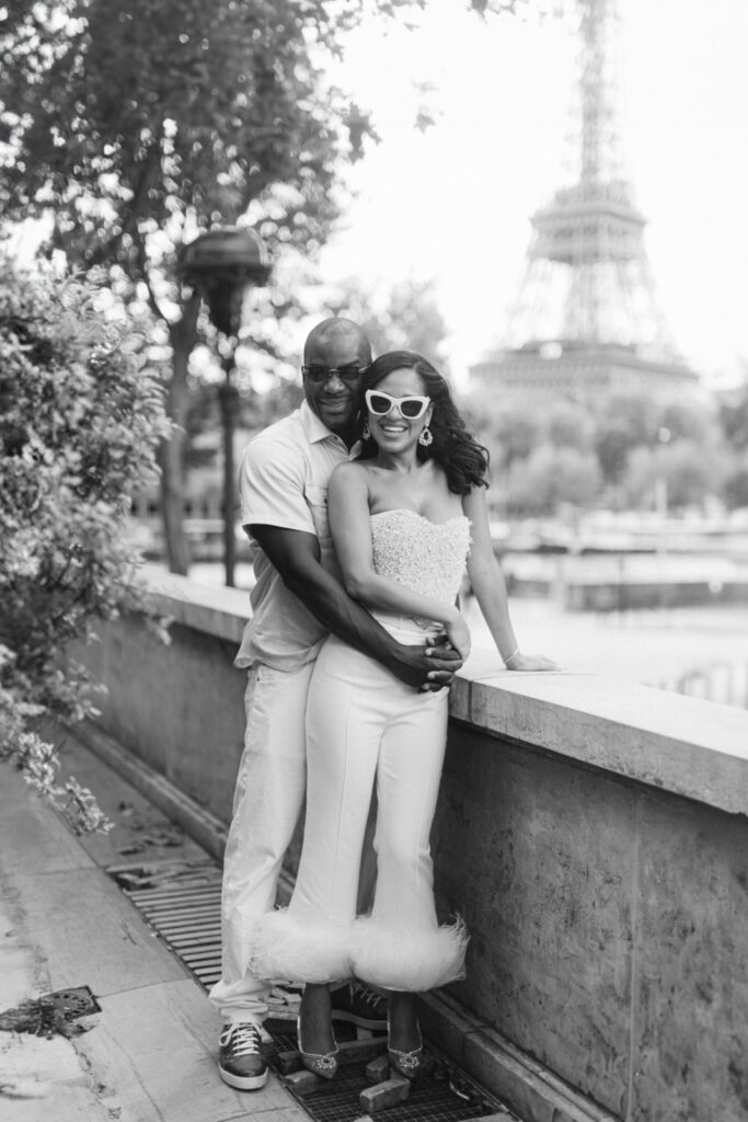 Captured in the glow of the setting sun, a couple shares a tender moment during their engagement session Trocadéro, with the Eiffel Tower lending its grandeur to their love story.