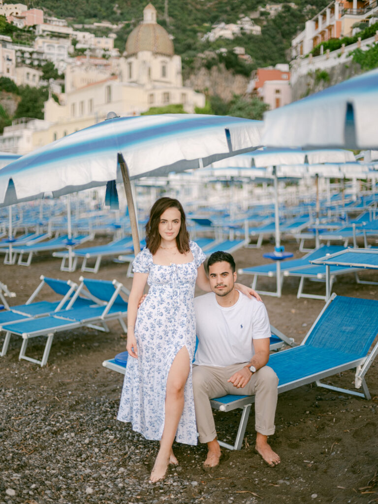 Celebrating their love on the Amalfi Coast, the couple gazes out at the sea, creating unforgettable memories during their honeymoon in Positano.
