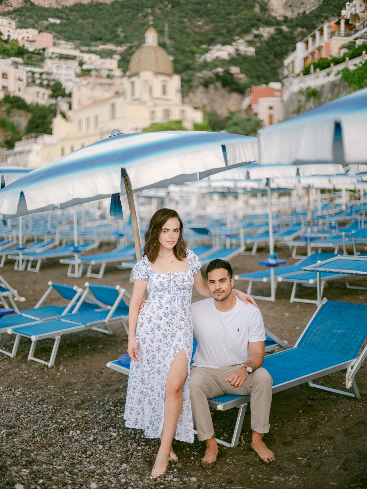 Celebrating their love on the Amalfi Coast, the couple gazes out at the sea, creating unforgettable memories during their honeymoon in Positano.