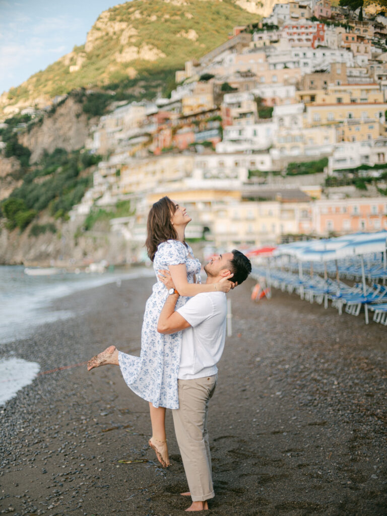 Celebrating their love on the Amalfi Coast, the couple gazes out at the sea, creating unforgettable memories during their honeymoon in Positano.
