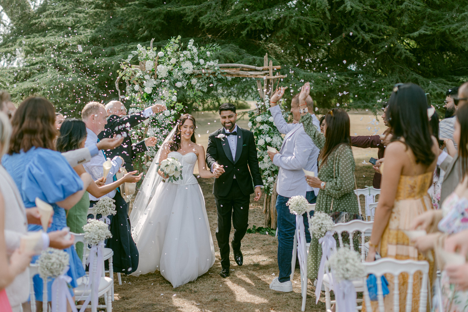 Guests watching a romantic wedding ceremony at Château de Seguin