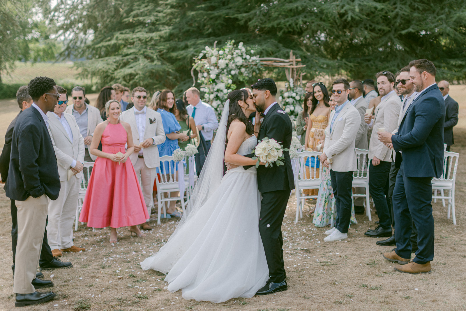 Guests watching a romantic wedding ceremony at Château de Seguin