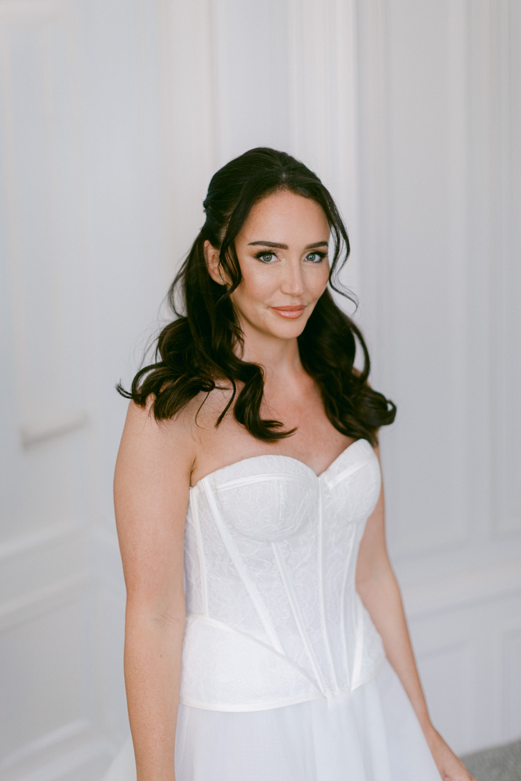 Bride getting ready in château suite at Château de Seguin wedding
