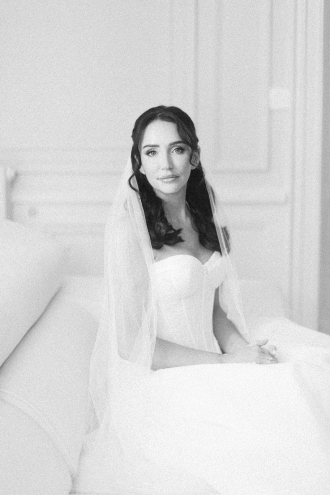 Bride getting ready in château suite at Château de Seguin wedding