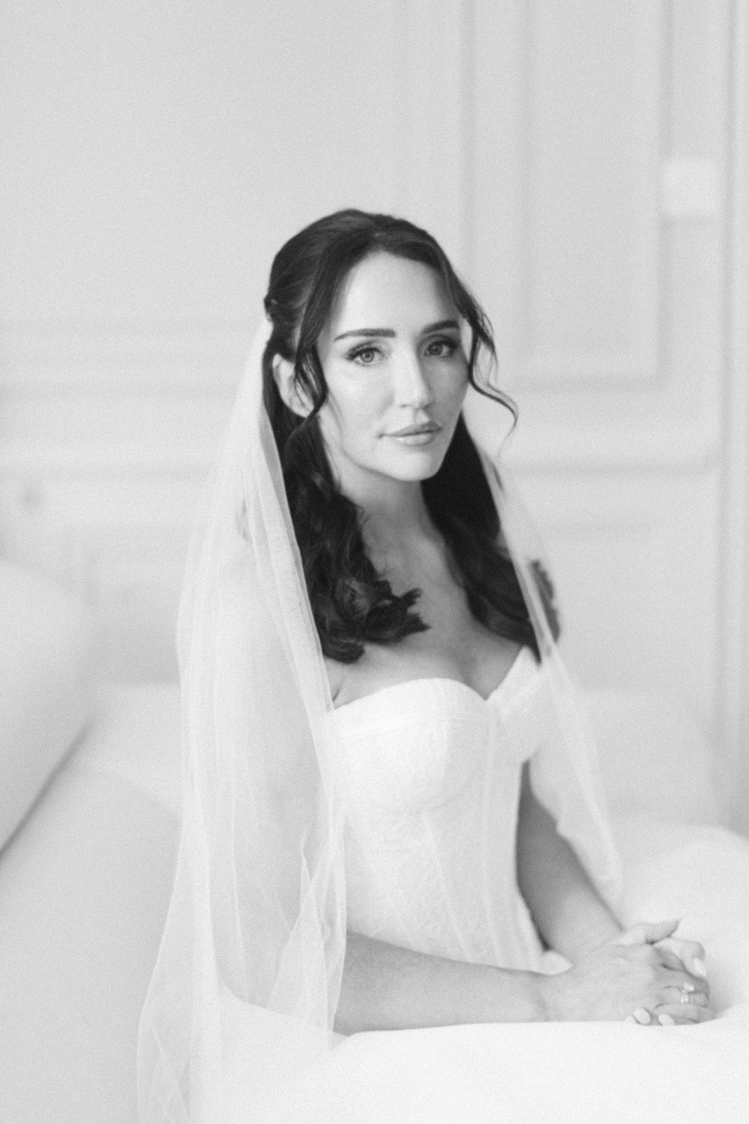 Bride getting ready in château suite at Château de Seguin wedding