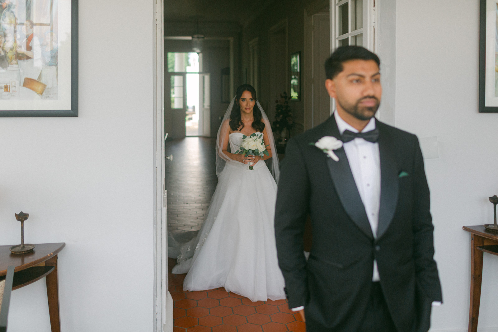 Emotional first look between bride and groom at Château de Seguin wedding in Bordeaux