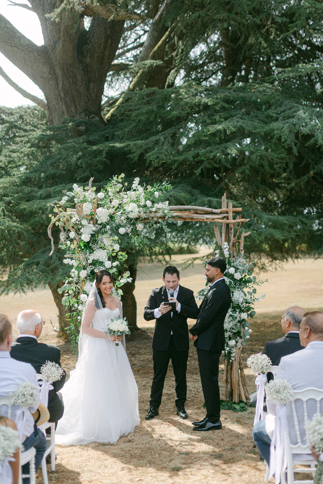 Outdoor wedding ceremony among the vineyards at Château de Seguin