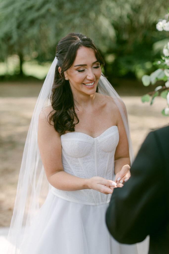 outdoor ceremony under trees at Château de Seguin wedding