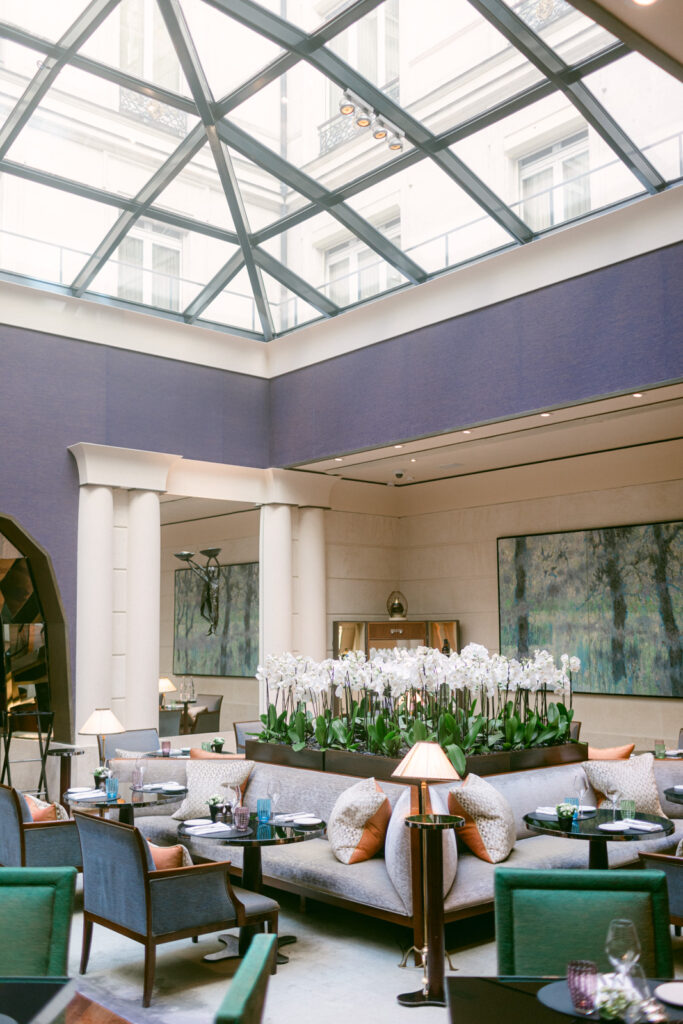 Chic dining space under glass roof at Park Hyatt Paris Vendôme, refined wedding venue