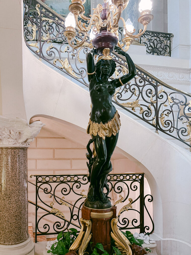 Artistic statue and grand staircase at Shangri-La Paris