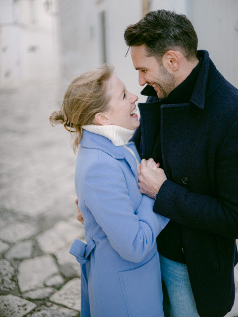 engagement photos in Ostuni Puglia with whitewashed buildings