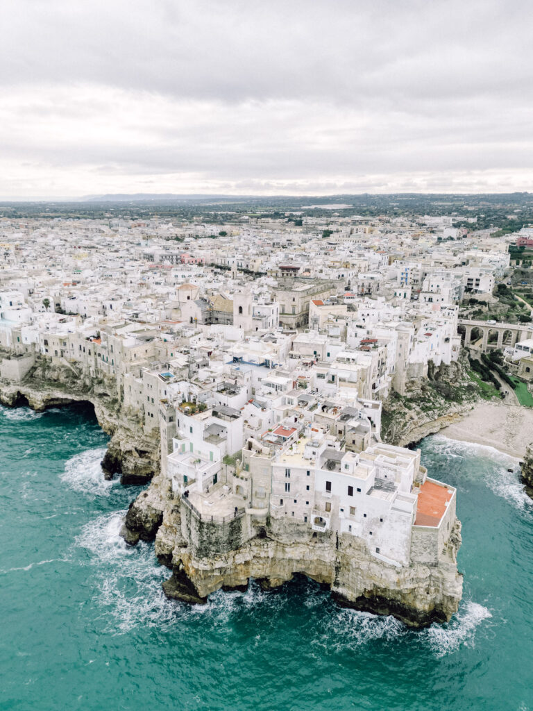 engagement photos in Ostuni Puglia with whitewashed buildings